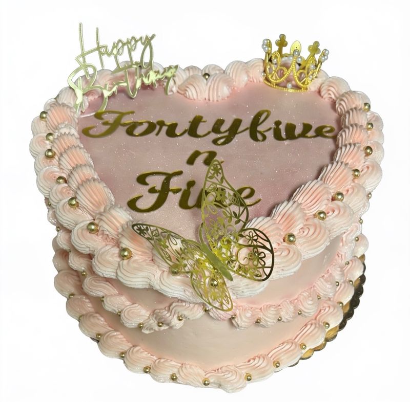 Pink heart cake lettered Forty five n Fine with pearls, butterflies and a crown